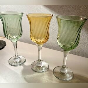 3 spiral wine glasses. 2 green & 1 amber. 7” H